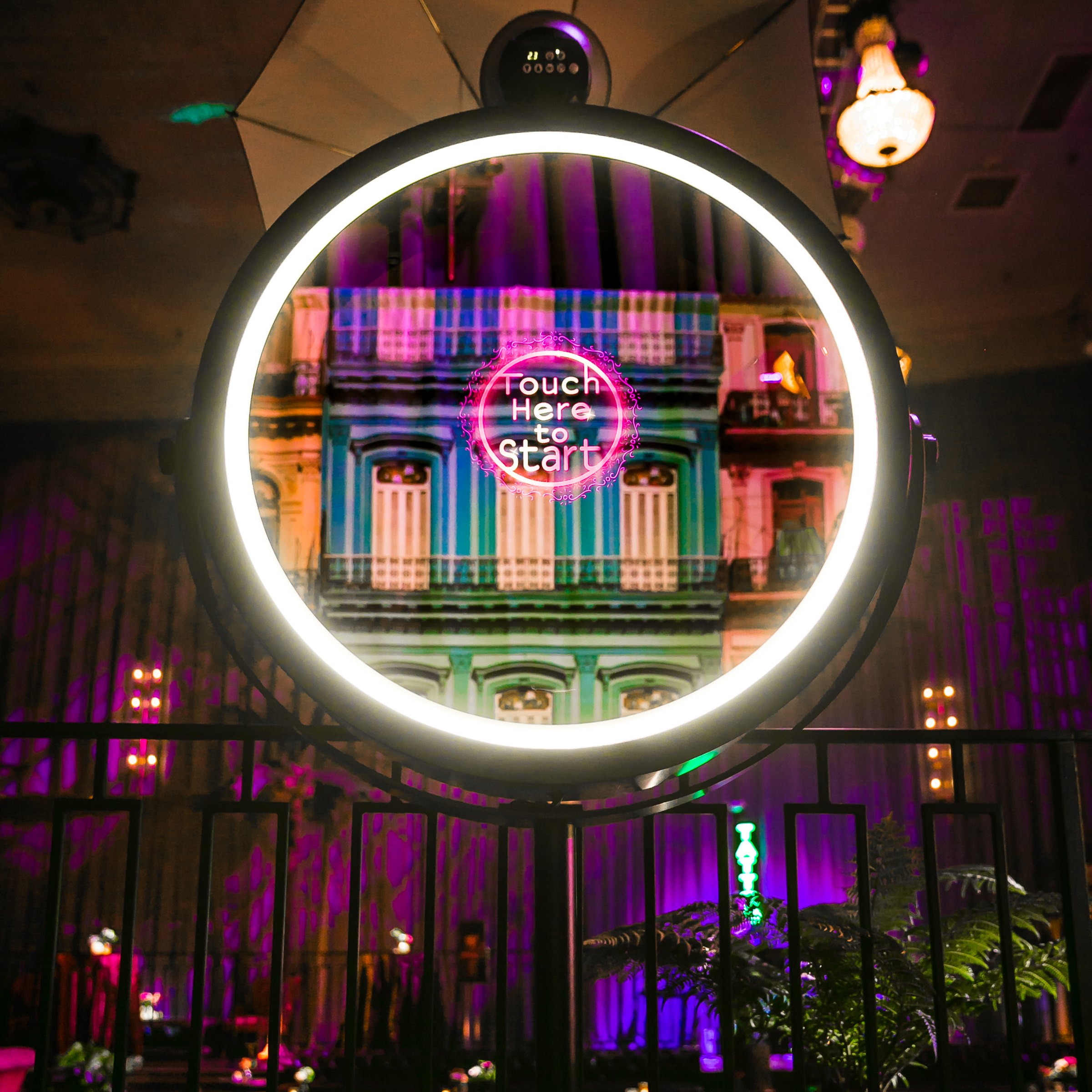 Close-up of the ring-lit mirror showing Touch Here to Start